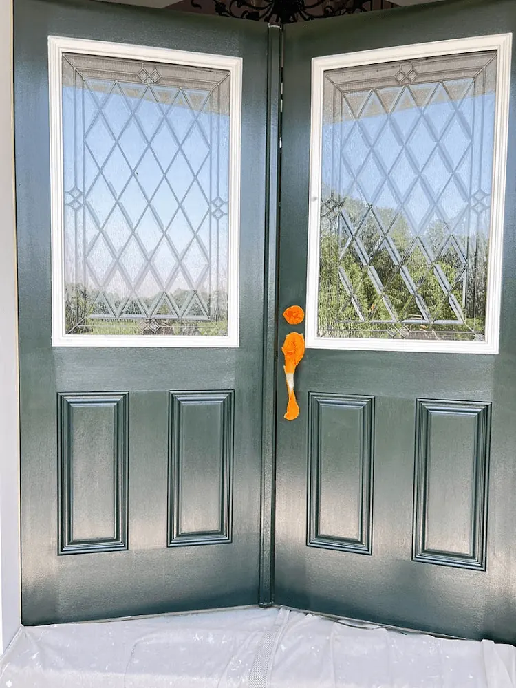 Double front doors painted dark green
