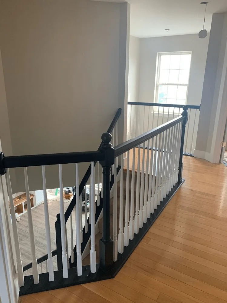 Interior stair railing painted navy and white